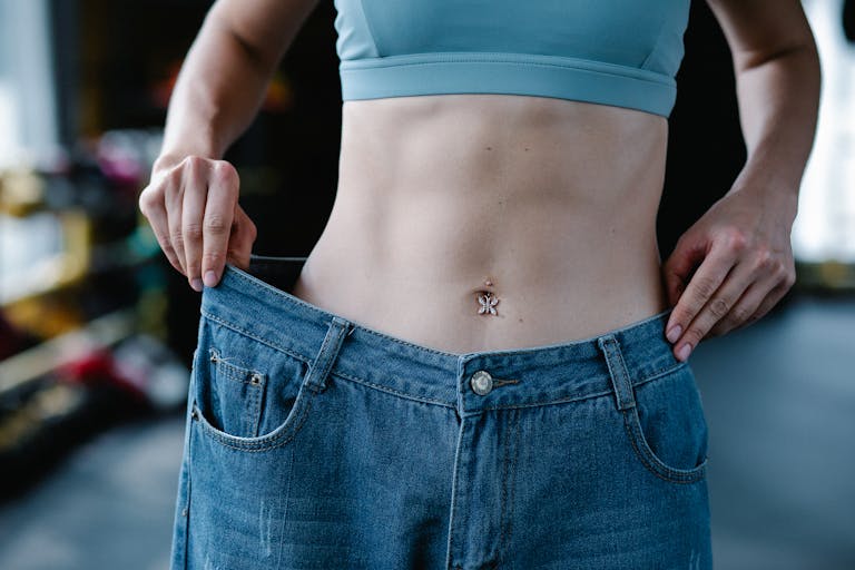 Woman Holding Large Jeans